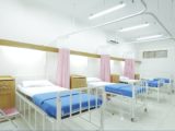 empty hospital bed inside room